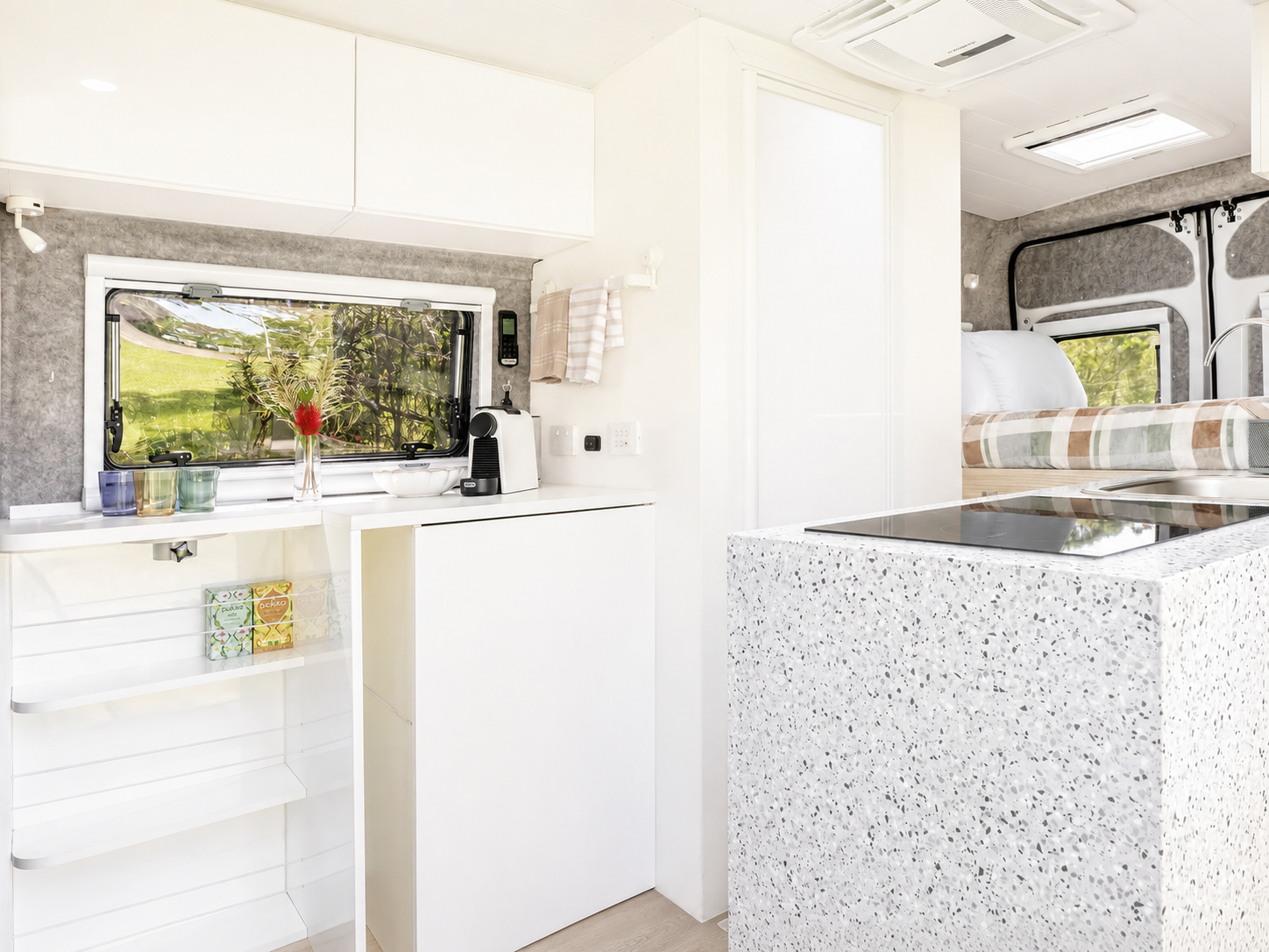 Interior of the van showing the kitchen and dining area